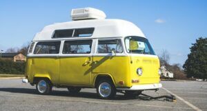 Image of yellow and white camper style truck