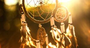 photo of a dream catcher with sunlight streaming through