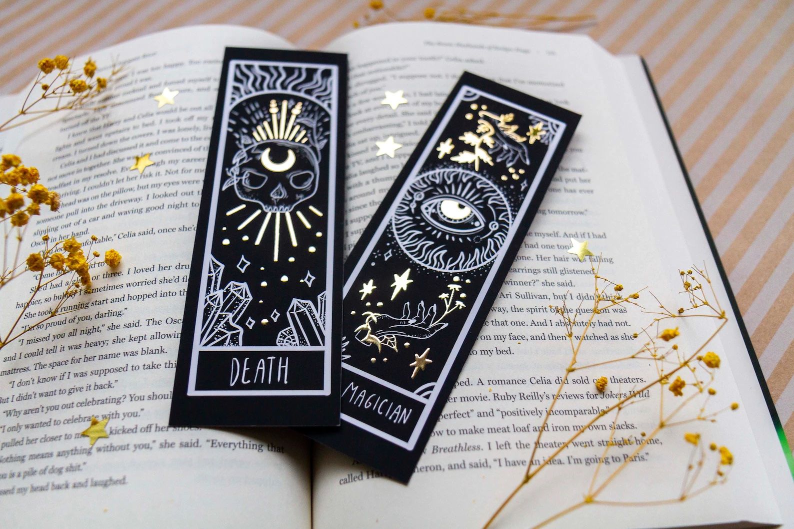 A set of black and gold bookmarks stylized to look like tarot cards