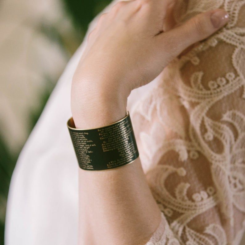 Cuff bracelet with text from Shakespeare's Macbeth. 