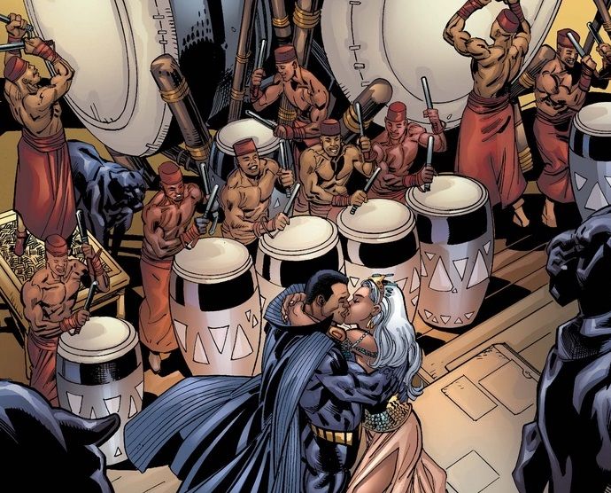 From Black Panther #18. Storm and Black Panther kiss surrounded by drummers and panther statues.