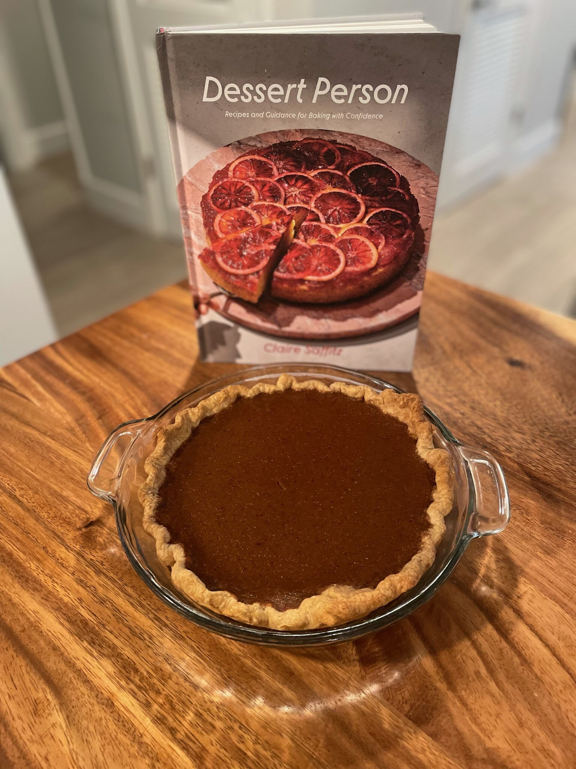Dark brown pumpkin pie with Claire Saffitz's Dessert Person cookbook