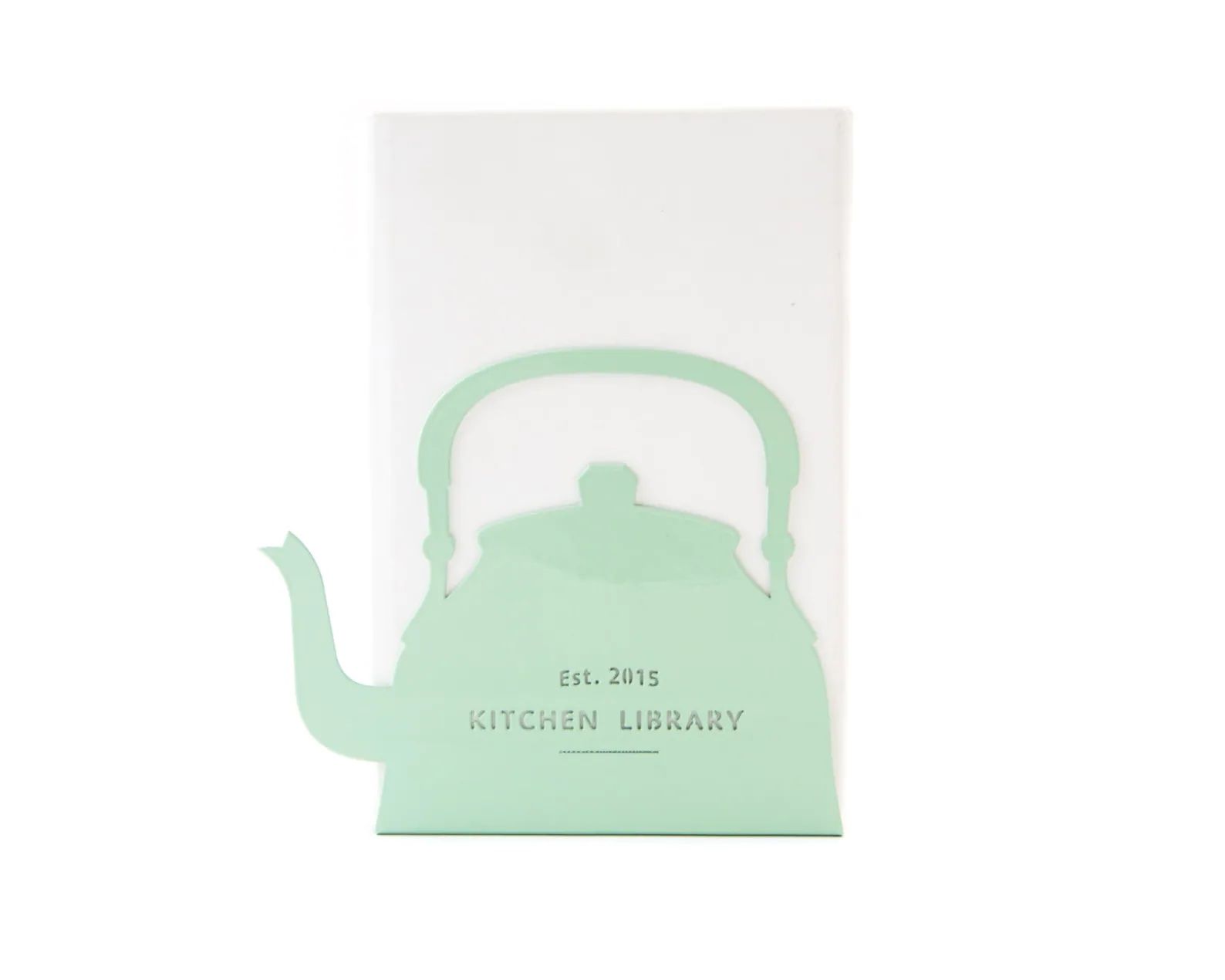 Mint green metal bookend in the shape of a tea kettle that reads "Kitchen Library, Est. 2015." The text is customizable.
