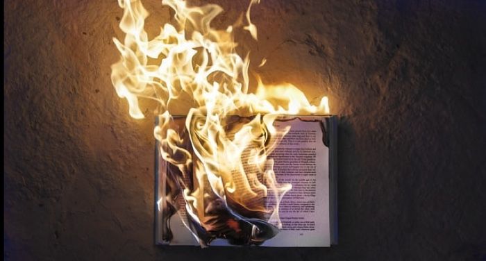 image of a burning book