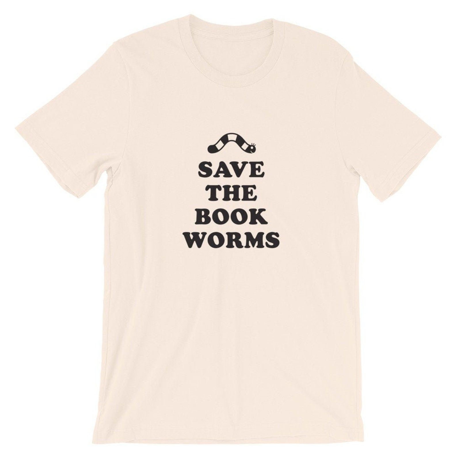 Image of a pink t-shirt. The black text reads "Save the book worms," with a worm above the word save. 