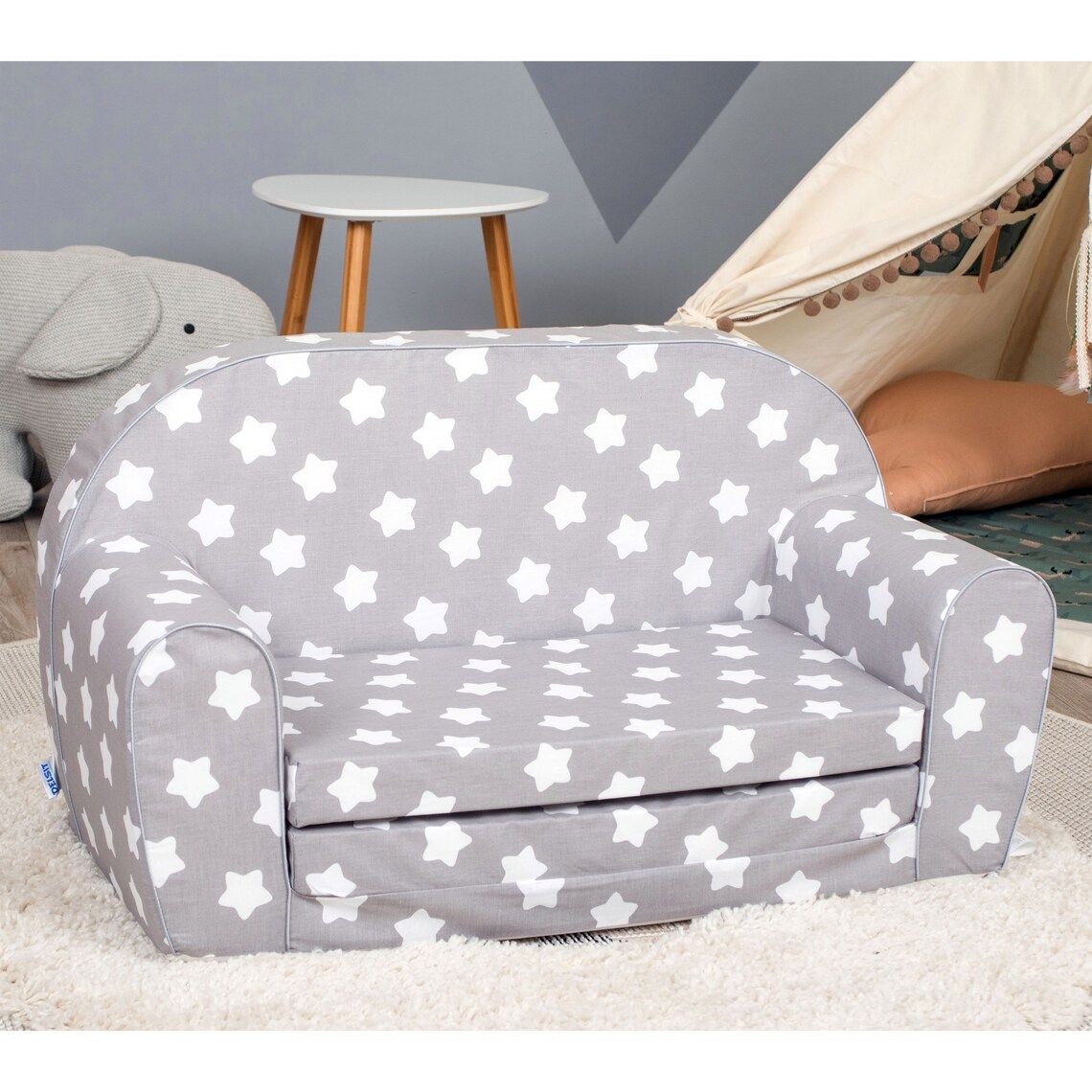 small gray couch with white stars all over