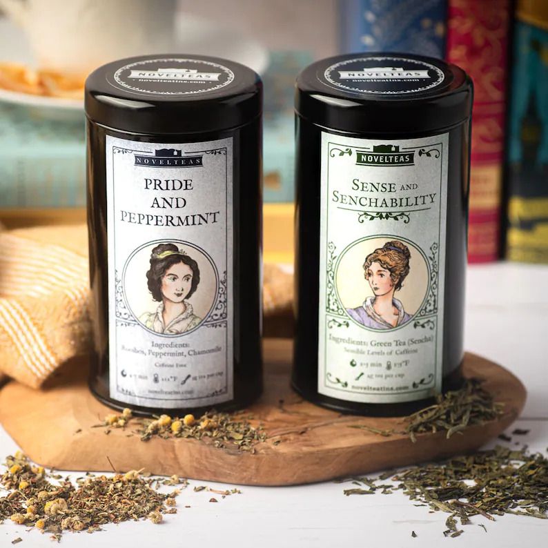 Image of two tea tins with illustrated Austen characters on the front