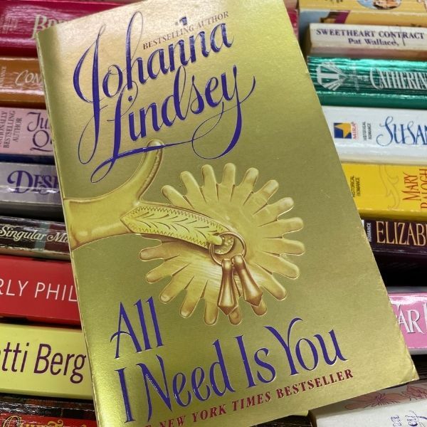 cover of Johanna Lindsey's All I Need Is You showing a close up of a boot spur