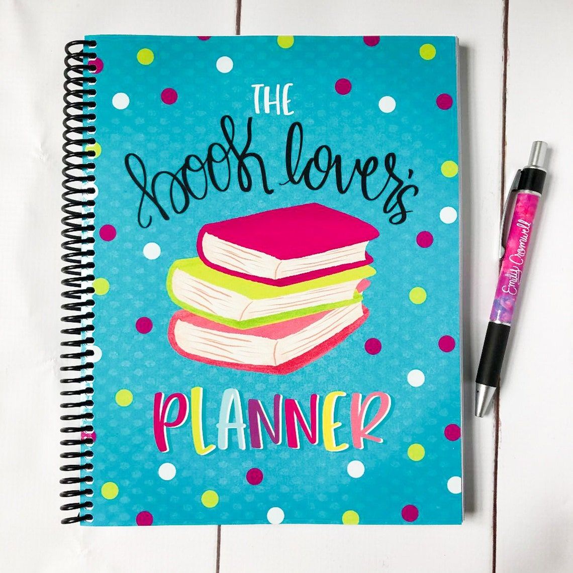 The Book Lover's Planner, showing a colourful polka dot cover and a stack of cartoon books