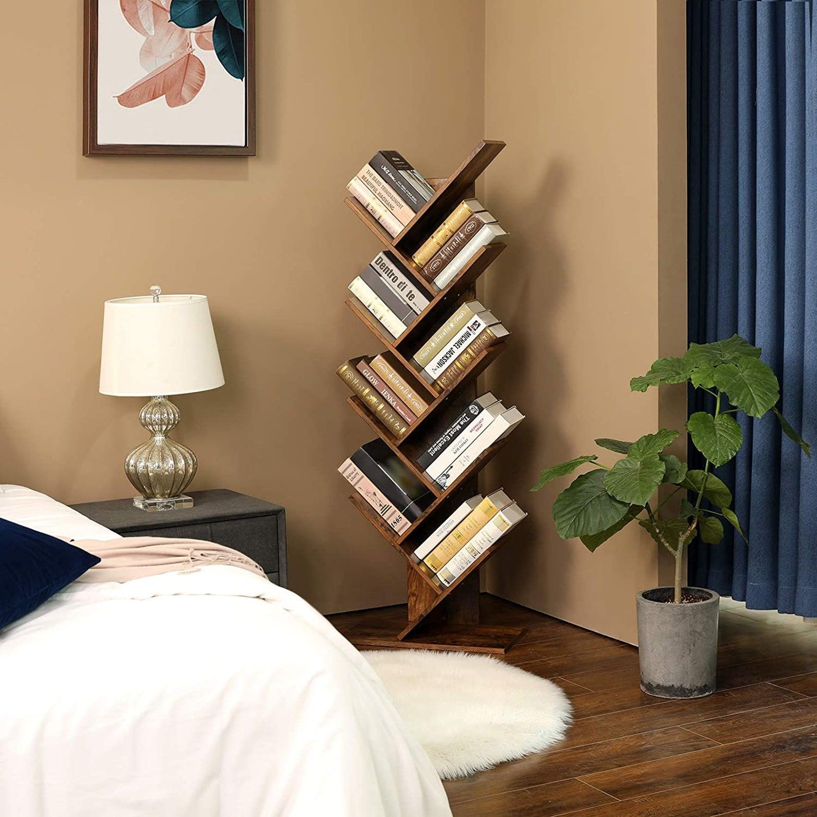 floor standing tree-shaped bookshelf with books on every shelf in the corner of a bedroom