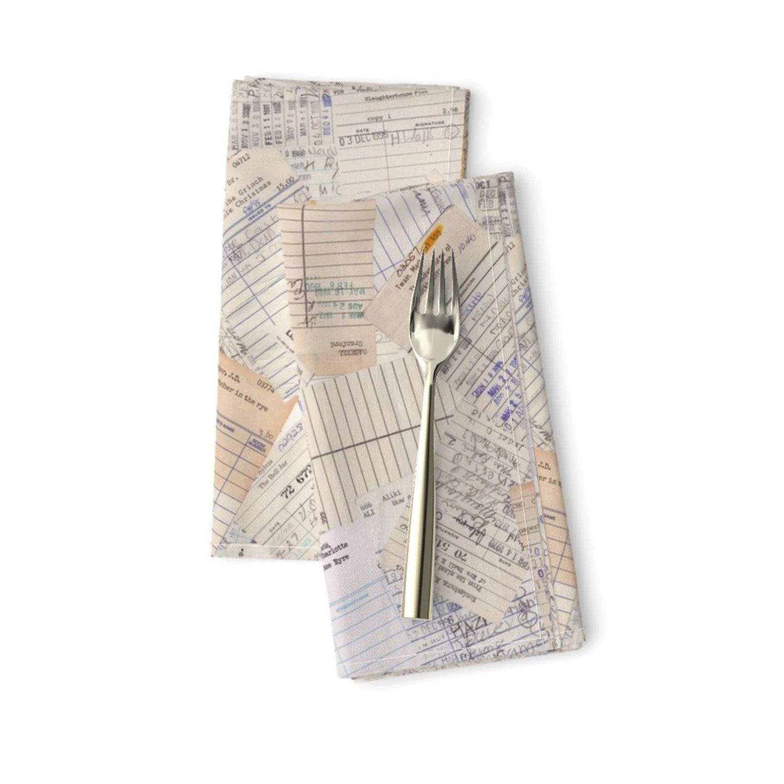 A fork, and two cloth napkins decorated with library date due stamps.