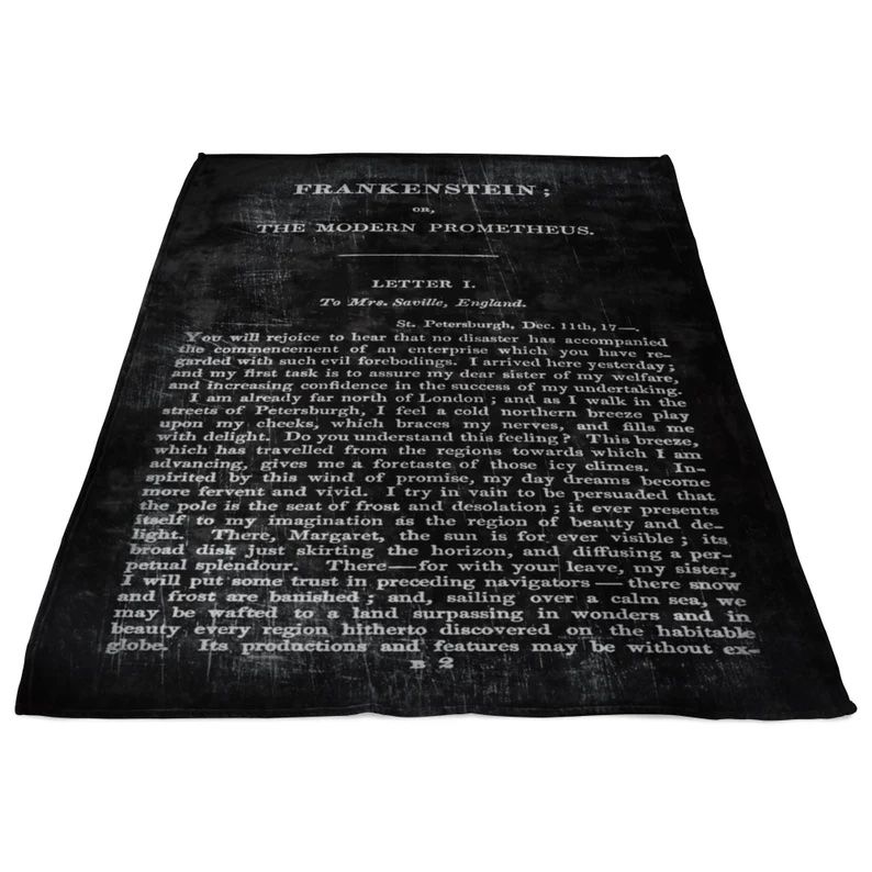 Black and white blanket with text from the book Frankenstein.