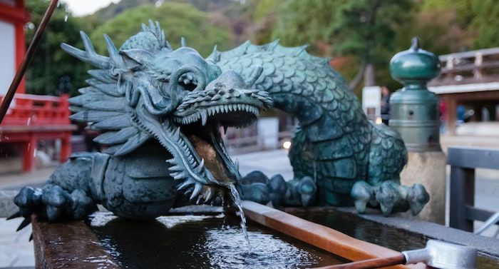 image of a green dragon statue in kyoto