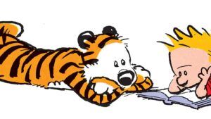 Calvin and Hobbes reading against white background