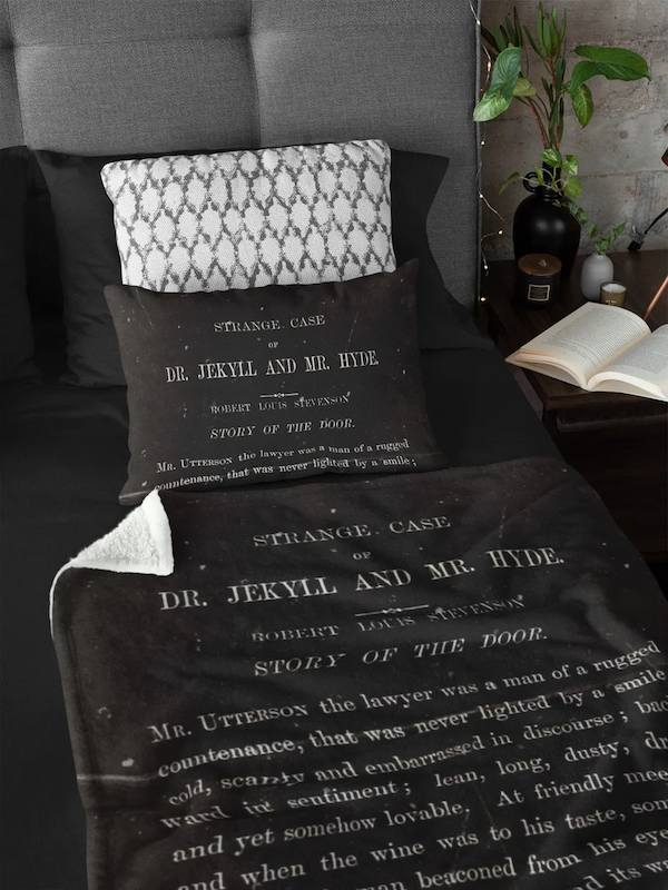 another blanket based on books including black blanket with white lettering featuring first page of The Strange Case of Dr. Jekyll and Mr. Hyde