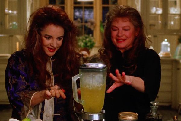 A screenshot of Aunts Jet and Frances from the Practical Magic movie (1998) are making magical margaritas in a blender. 