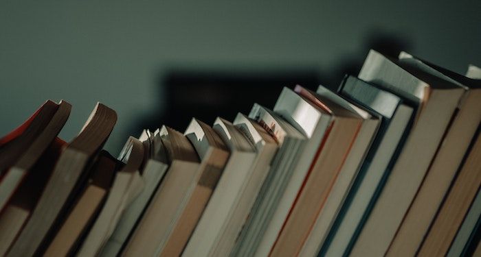 image of books leaning on one another
