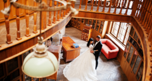 a photo of a bride and groom in a library