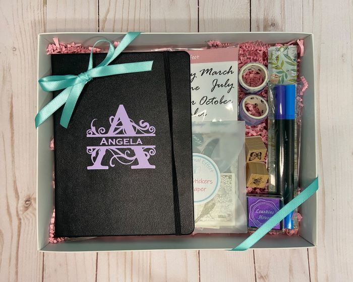 notebook gift set with pens, tape, and stickers