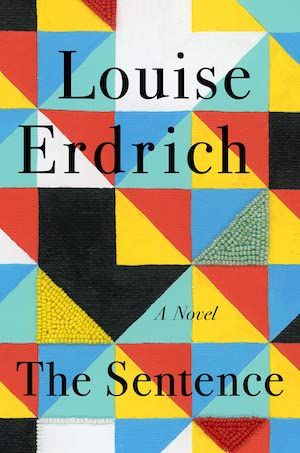 cover of The Sentence by Louise Erdrich; a repeating geometric pattern of squares and triangles in reds, blues, yellows, blacks, and whites