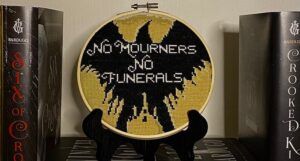 a photo of a No mourners no funerals cross stitch