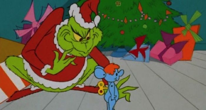 a scene from The Grinch Stole Christmas where the Grinch is stealing a toy