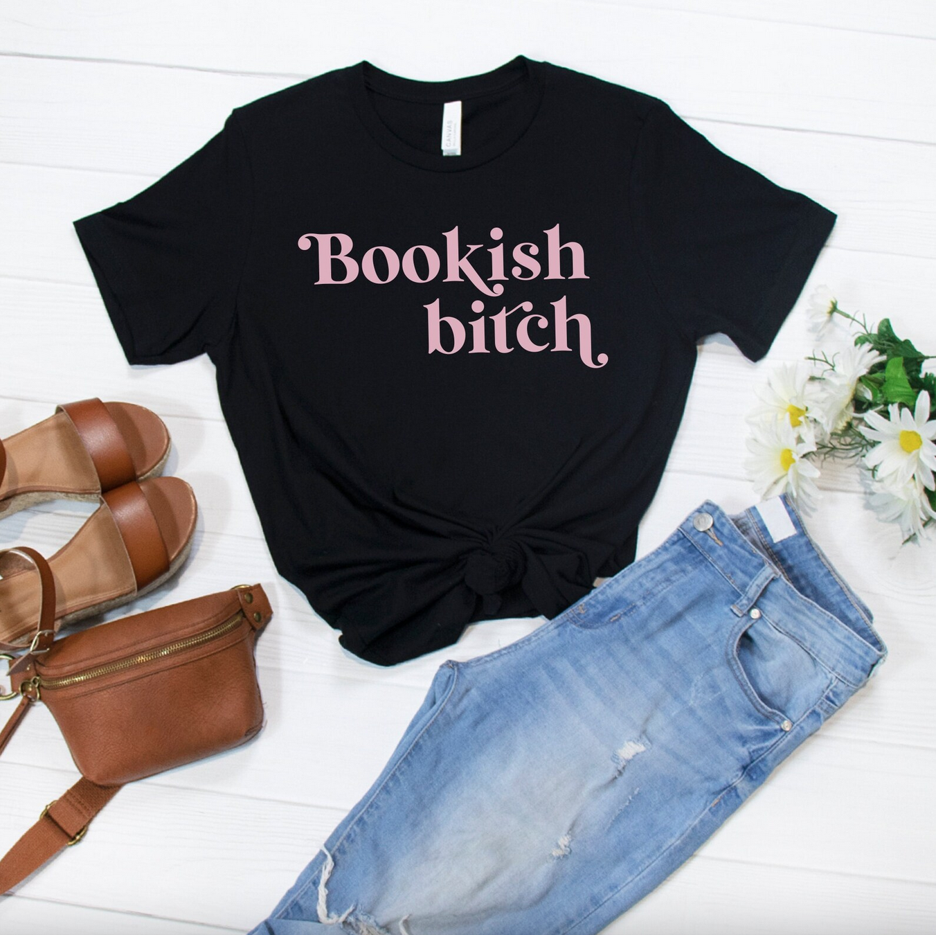 Black tshirt with pink font reading "bookish bitch"