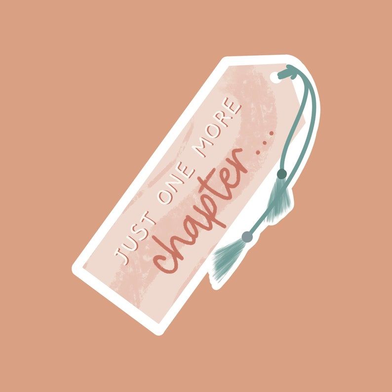 Image of a bookmark shaped sticker on a peach background. The pink colored bookmark reads "just one more chapter . . . " and features green tassels. 