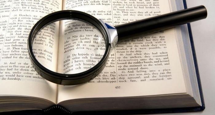 image of a magnifying glass on a book