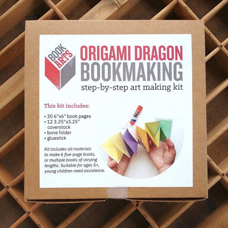 Image of  box containing the tools to make an origami dragon bookmark.