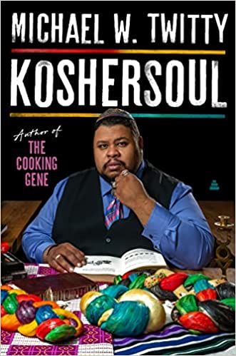 cover of Koshersoul by Michael W. Twitty; photo of Twitty, a Black man, wearing a yarmulke and sitting at a table surrounded by food