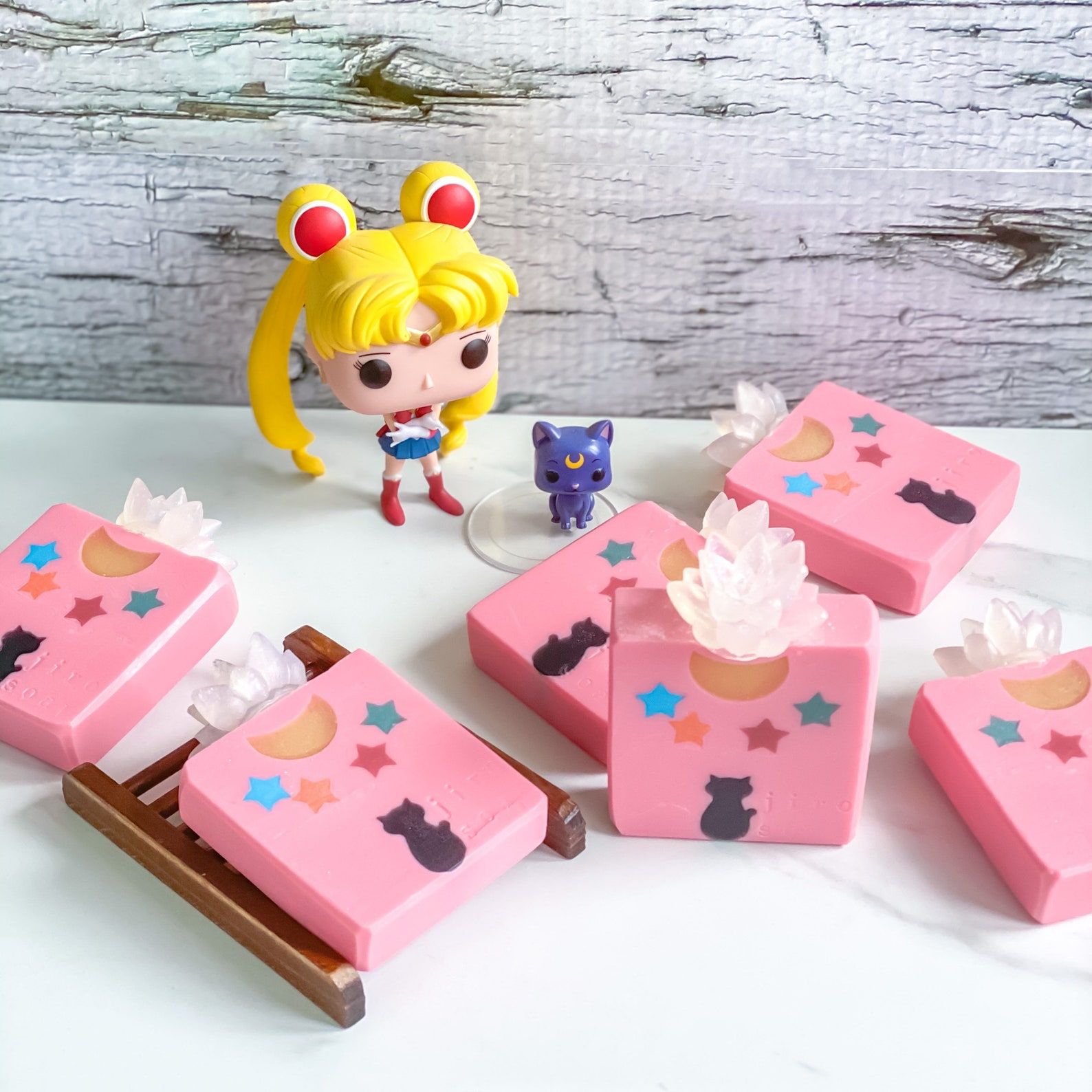 Sailor Moon Funk pop figurine net to six pink bars of vegan Sailor Moon themed soap