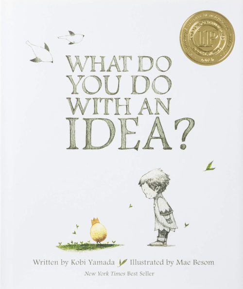 A young child looks down at a yellow baby chick on a white background. This is the cover for What Do You Do With An Idea? by Kobi Yamada