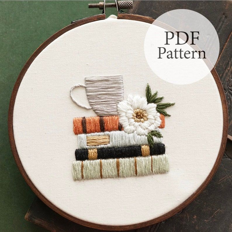 Embroidery pattern that features four books, flowers, and a big mug. 