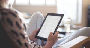 image of a person reading on an ereader
