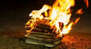 a stack of burning books