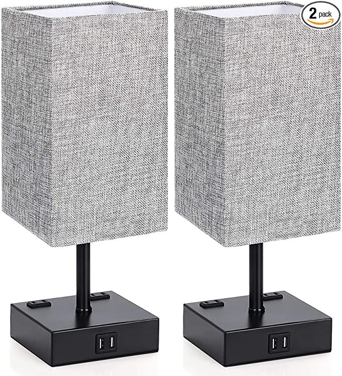 a photo of two grey side table lamps