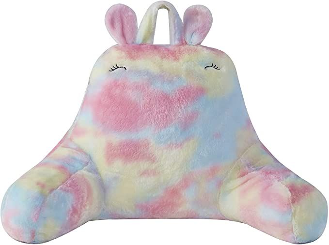 a fuzzy rainbow reading pillow for kids