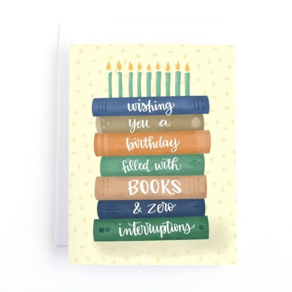 Birthday card with stacked books and candles that says "Wishing you a birthday filled with books and zero distractions."