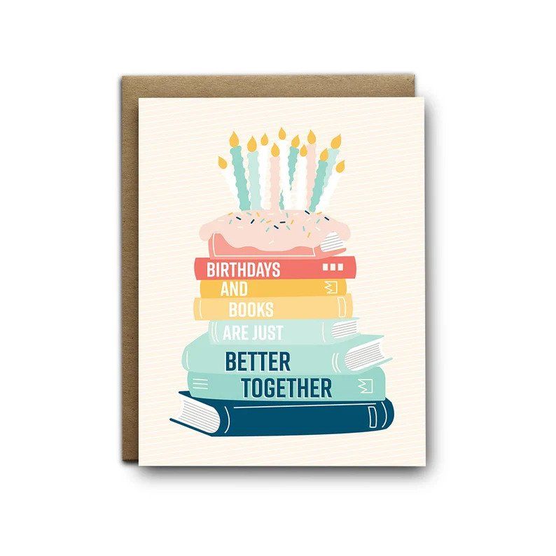 Greeting card with a stack of books with icing and candles on top. The book spines spell out "