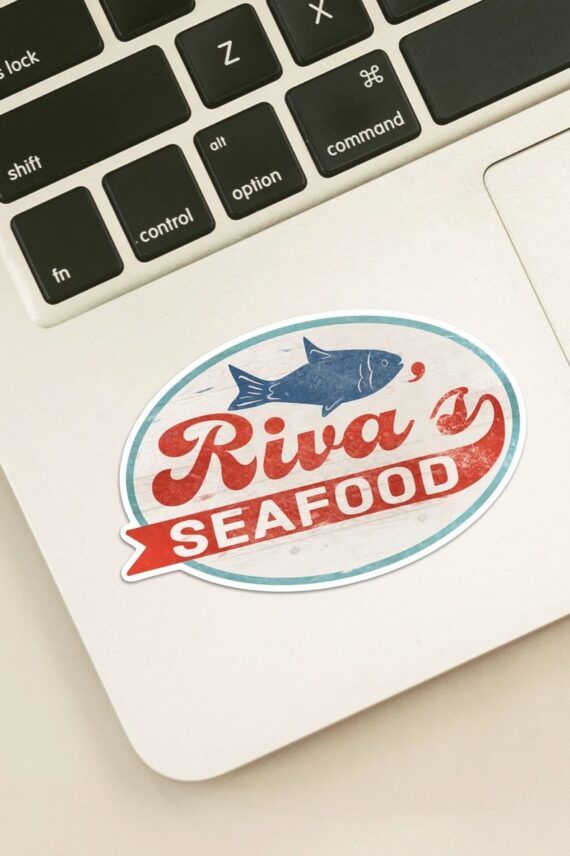 Sticker with a blue fish and the words "Riva's Seafood" written on read underneath