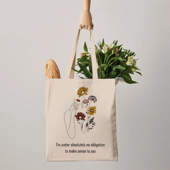 Evelyn Hugo quote with a silhouette and flowers in a tote bag