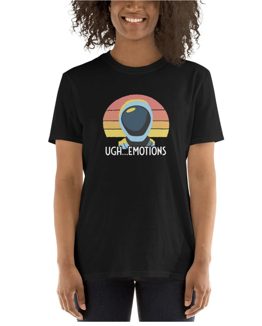 A black t-shirt with a stylized sunset and an astronaut-style bust. The text reads, "UGH... EMOTIONS"