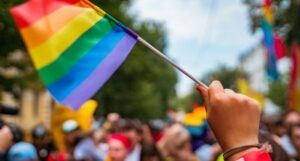 Hand Hold a Gay Lgbt Flag at a Pride Parade Festival