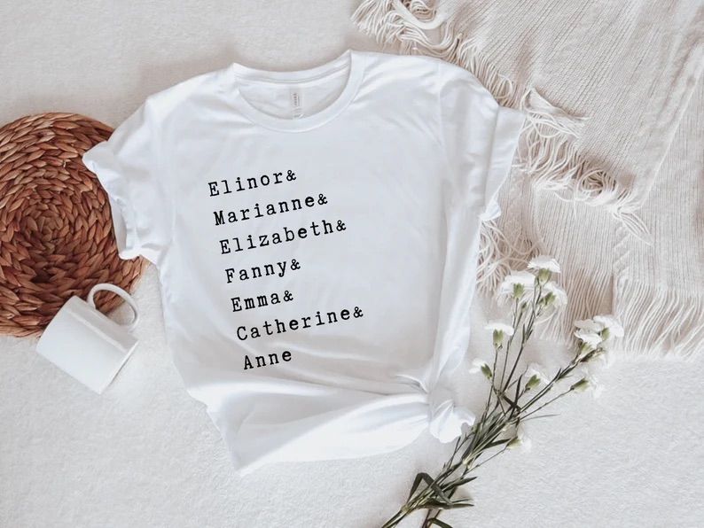 Photo of a white t-shirt showing the names Elinor & Marianne & Elizabeth & Fanny & Emma & Catherine & Anne, all one above the other. 