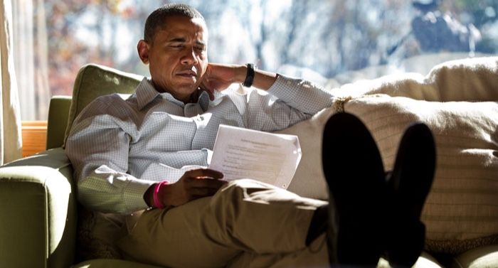 a photo of Obama reading