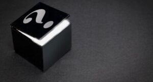 black and white image of a black box with a question mark on the lid