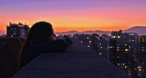A photo of a woman looking out over Santiago, Chile