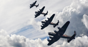 a photo of British world war two planes flying in formation