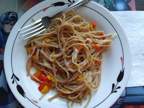 Author photo of a plate of fettuccine with a lot of peppers and very little mozzarella